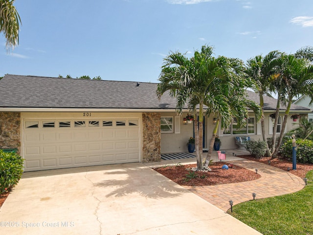 201 Woody Cir, Melbourne Beach, FL 32951 - single story home featuring driveway, a garage, stone siding, and a shingled roof