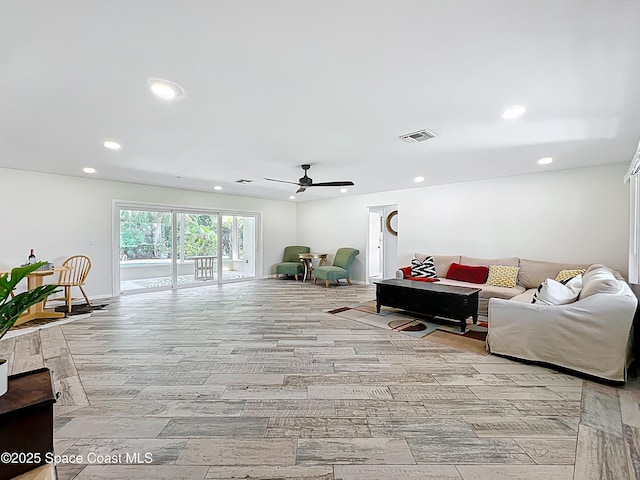 201 Woody Cir, Melbourne Beach, FL 32951 - living room with ceiling fan, recessed lighting, and light wood finished floors