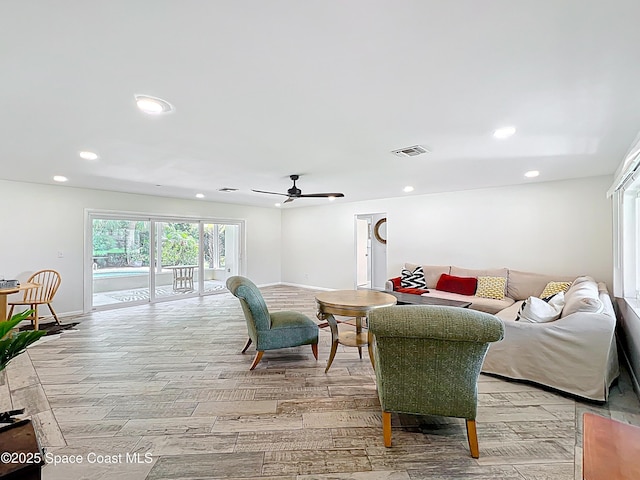 201 Woody Cir, Melbourne Beach, FL 32951 - living area with light wood-type flooring, recessed lighting, baseboards, and a ceiling fan