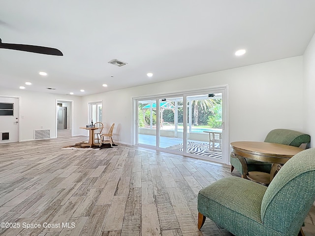 201 Woody Cir, Melbourne Beach, FL 32951 - sitting room with light wood-style floors, a ceiling fan, recessed lighting, and baseboards