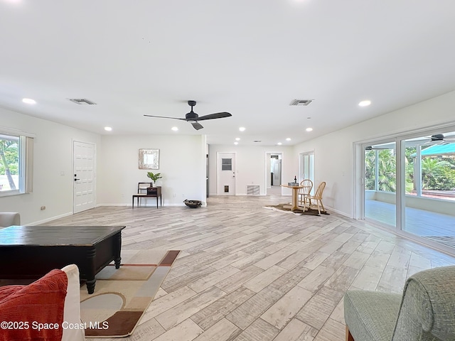 201 Woody Cir, Melbourne Beach, FL 32951 - living room featuring light wood-style floors, recessed lighting, ceiling fan, and baseboards