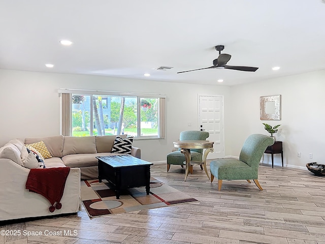201 Woody Cir, Melbourne Beach, FL 32951 - living area with light wood finished floors, ceiling fan, recessed lighting, and baseboards