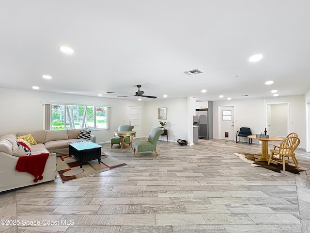201 Woody Cir, Melbourne Beach, FL 32951 - living area with recessed lighting, ceiling fan, baseboards, and light wood-type flooring