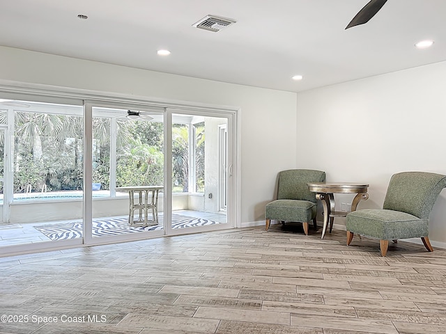 201 Woody Cir, Melbourne Beach, FL 32951 - living area with a ceiling fan, light wood-style flooring, recessed lighting, and baseboards