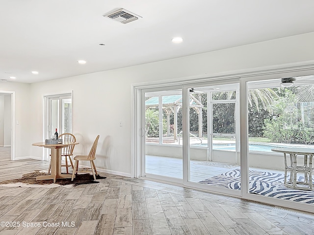 201 Woody Cir, Melbourne Beach, FL 32951 - dining room featuring light wood finished floors, recessed lighting, and baseboards