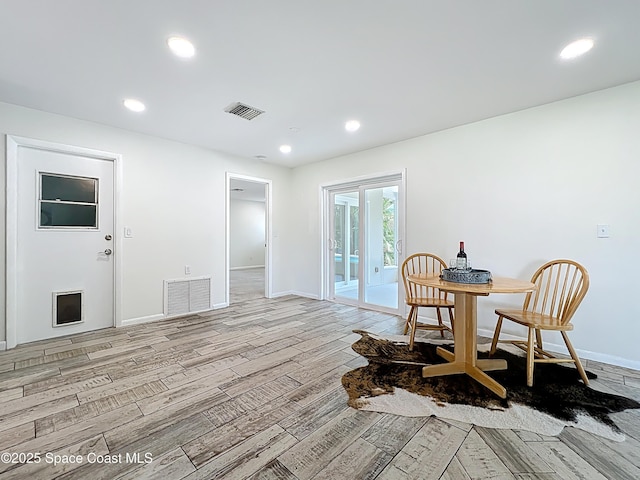 201 Woody Cir, Melbourne Beach, FL 32951 - dining room featuring light wood-type flooring, baseboards, and recessed lighting
