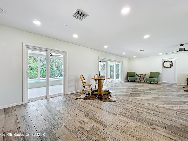 201 Woody Cir, Melbourne Beach, FL 32951 - living area with light wood-style floors, a ceiling fan, baseboards, and recessed lighting