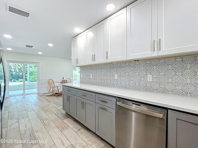 201 Woody Cir, Melbourne Beach, FL 32951 - kitchen featuring stainless steel dishwasher, gray cabinetry, recessed lighting, and decorative backsplash
