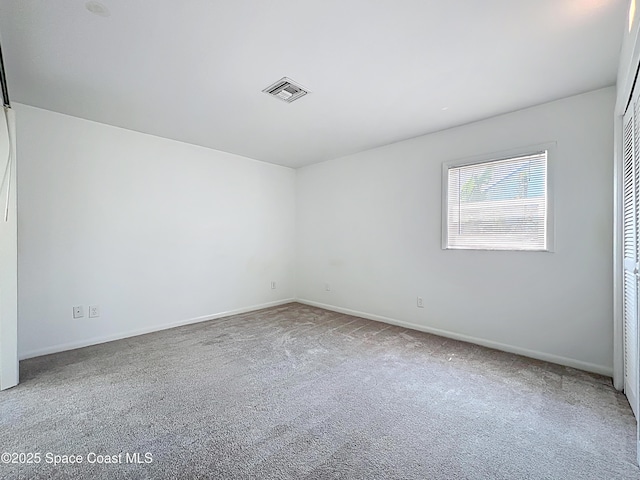 201 Woody Cir, Melbourne Beach, FL 32951 - carpeted empty room featuring baseboards