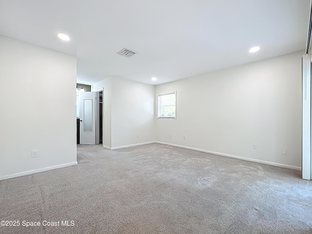 201 Woody Cir, Melbourne Beach, FL 32951 - carpeted empty room with baseboards and recessed lighting