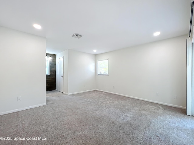 201 Woody Cir, Melbourne Beach, FL 32951 - carpeted empty room featuring baseboards and recessed lighting