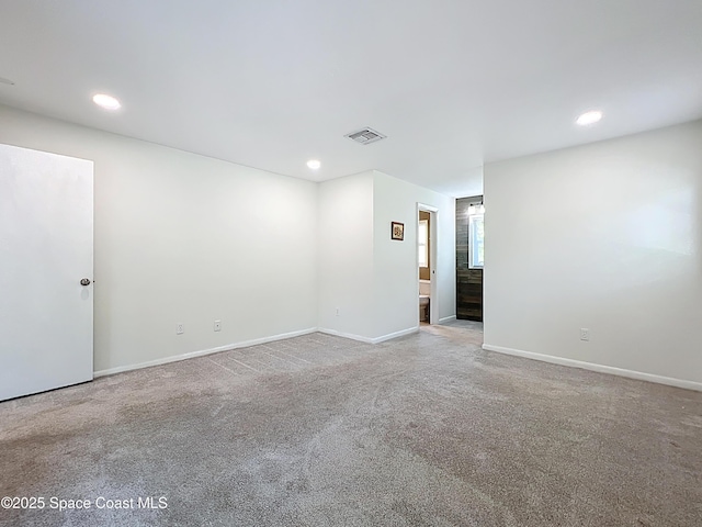 201 Woody Cir, Melbourne Beach, FL 32951 - spare room featuring carpet, baseboards, and recessed lighting