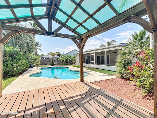 201 Woody Cir, Melbourne Beach, FL 32951 - view of pool with ceiling fan, a fenced backyard, a patio area, and a pergola