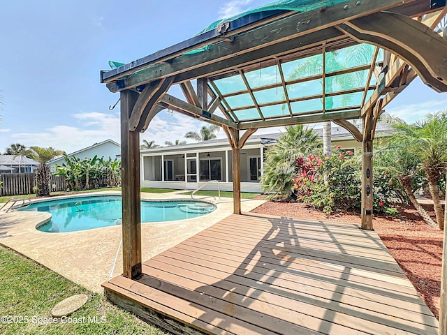201 Woody Cir, Melbourne Beach, FL 32951 - view of swimming pool with a sunroom, a patio, a deck, and a ceiling fan