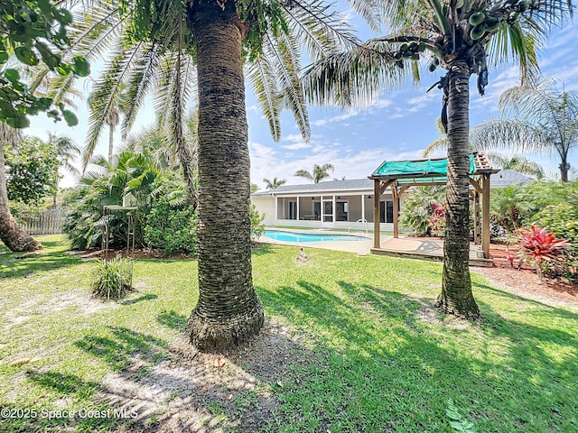 201 Woody Cir, Melbourne Beach, FL 32951 - view of yard featuring a gazebo and a sunroom