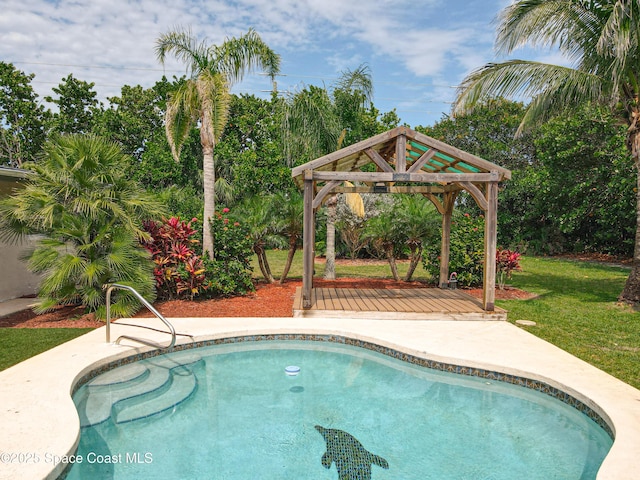 201 Woody Cir, Melbourne Beach, FL 32951 - outdoor pool featuring a gazebo, a lawn, and view of wooded area