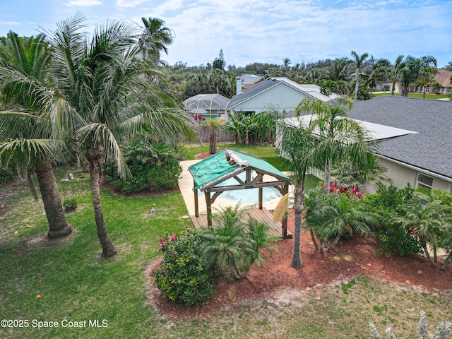 201 Woody Cir, Melbourne Beach, FL 32951 - view of grassy yard with a lanai