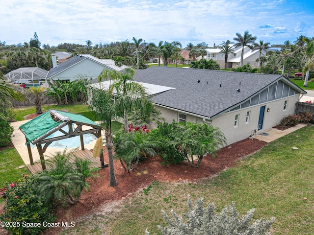 201 Woody Cir, Melbourne Beach, FL 32951 - back of property with roof with shingles, stucco siding, and a residential view