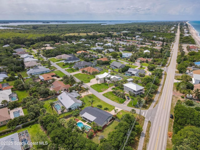 201 Woody Cir, Melbourne Beach, FL 32951 - aerial overview of property's location with a nearby body of water, nearby suburban area, and a pool area