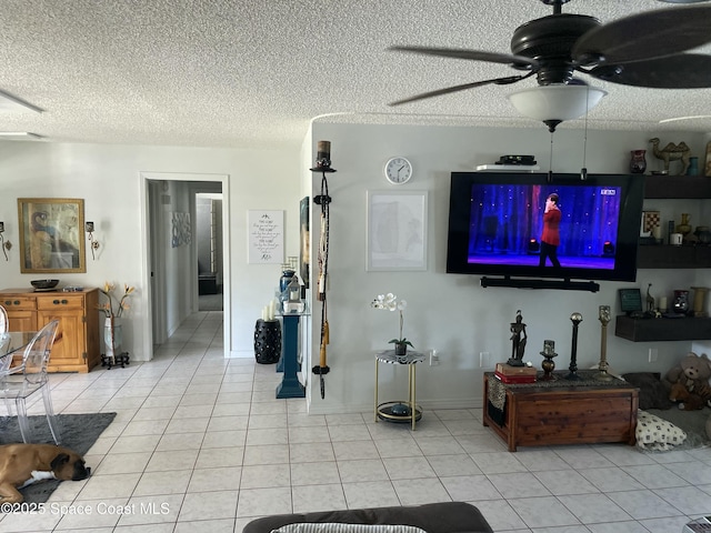 610 Buttonwood Dr, Merritt Island, FL 32953 - living room featuring a ceiling fan, light tile patterned floors, and a textured ceiling