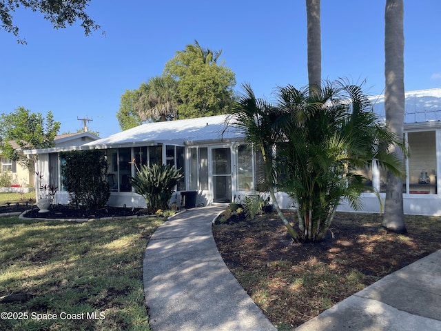 610 Buttonwood Dr, Merritt Island, FL 32953 - view of front of property with a sunroom