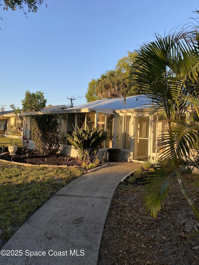 610 Buttonwood Dr, Merritt Island, FL 32953 - view of front of house featuring concrete driveway