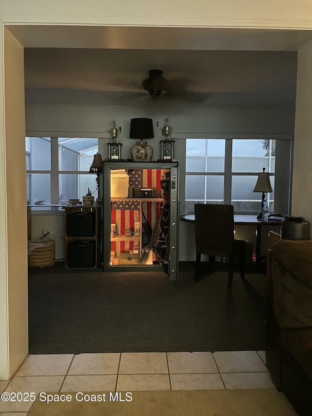 610 Buttonwood Dr, Merritt Island, FL 32953 - carpeted living room with ceiling fan, plenty of natural light, an office area, and tile patterned flooring