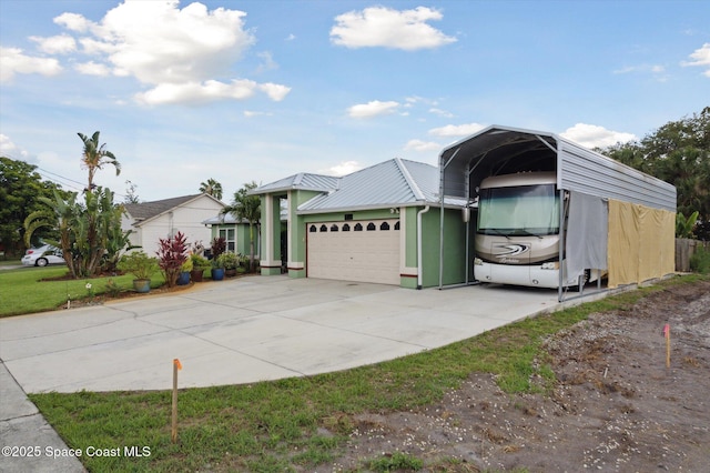 4625 Curtis Blvd, Cocoa, FL 32927 - view of front facade with a detached carport, a garage, and concrete driveway