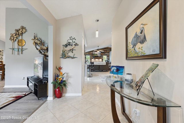 4625 Curtis Blvd, Cocoa, FL 32927 - corridor featuring vaulted ceiling, baseboards, and light tile patterned floors