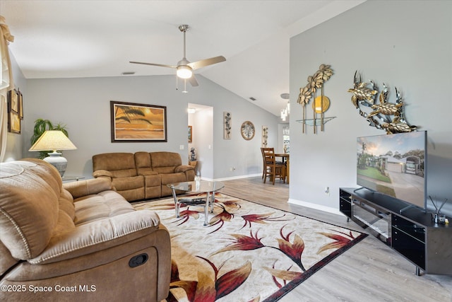 4625 Curtis Blvd, Cocoa, FL 32927 - living area featuring wood finished floors, ceiling fan, baseboards, and vaulted ceiling