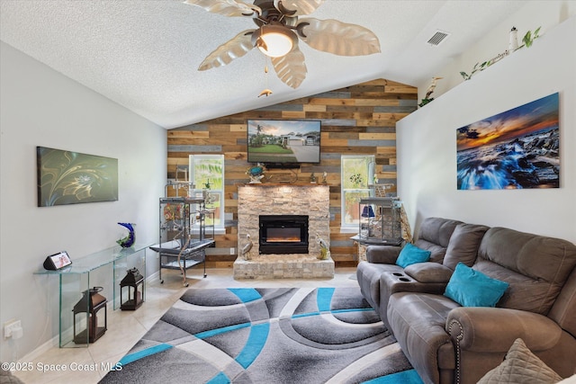 4625 Curtis Blvd, Cocoa, FL 32927 - living room featuring lofted ceiling, wood walls, a ceiling fan, a fireplace, and baseboards