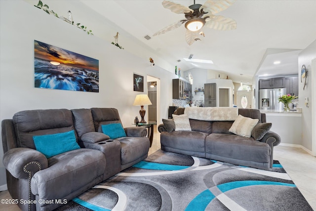 4625 Curtis Blvd, Cocoa, FL 32927 - living room with a ceiling fan, light tile patterned floors, vaulted ceiling, and baseboards