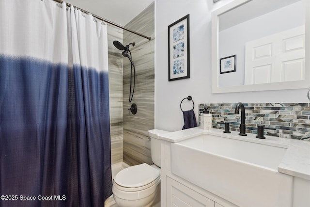 4625 Curtis Blvd, Cocoa, FL 32927 - full bathroom featuring toilet, vanity, tasteful backsplash, and a shower with shower curtain