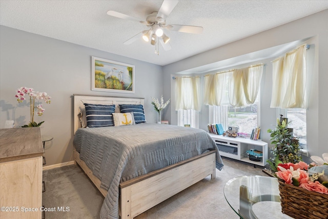 4625 Curtis Blvd, Cocoa, FL 32927 - carpeted bedroom with ceiling fan and a textured ceiling