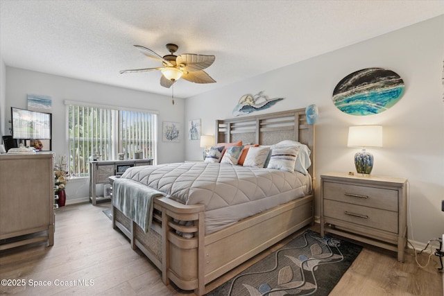4625 Curtis Blvd, Cocoa, FL 32927 - bedroom with light wood finished floors, ceiling fan, and baseboards