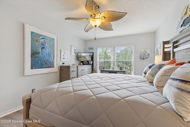 4625 Curtis Blvd, Cocoa, FL 32927 - bedroom featuring wood finished floors, a textured ceiling, ceiling fan, and baseboards
