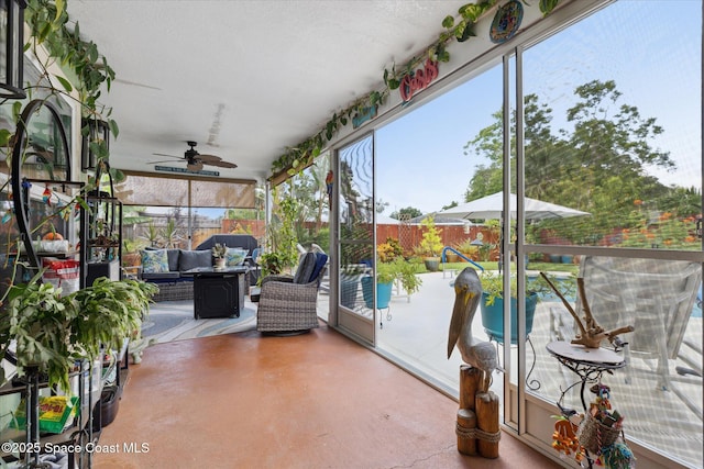 4625 Curtis Blvd, Cocoa, FL 32927 - sunroom / solarium featuring an outdoor hangout area, a ceiling fan, finished concrete floors, and plenty of natural light