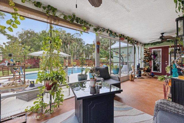 4625 Curtis Blvd, Cocoa, FL 32927 - sunroom / solarium with a ceiling fan, concrete floors, and a textured ceiling