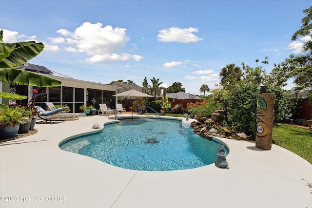 4625 Curtis Blvd, Cocoa, FL 32927 - swimming pool with a sunroom, a patio, and a fenced backyard