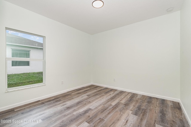 123 Garylind St SW, Palm Bay, FL 32908 - spare room with wood finished floors and baseboards