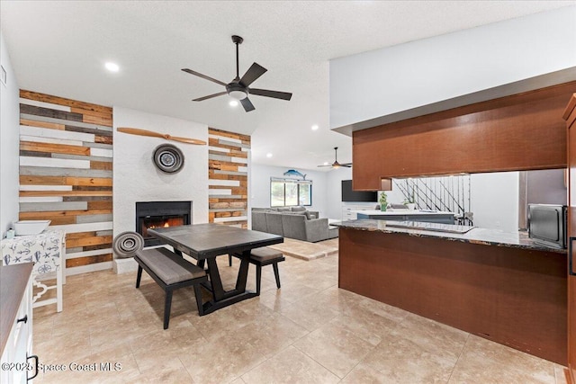 2350 Fallon Blvd NE, Palm Bay, FL 32907 - kitchen with a ceiling fan, a large fireplace, open floor plan, recessed lighting, and wooden walls