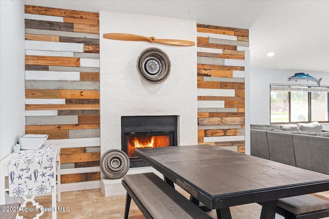 2350 Fallon Blvd NE, Palm Bay, FL 32907 - dining room with wooden walls, a lit fireplace, and recessed lighting