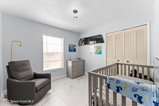 2350 Fallon Blvd NE, Palm Bay, FL 32907 - bedroom with marble look tiles, a closet, a textured ceiling, and baseboards