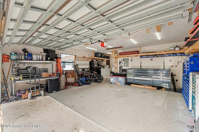 2350 Fallon Blvd NE, Palm Bay, FL 32907 - garage with a workshop area, a garage door opener, and electric panel