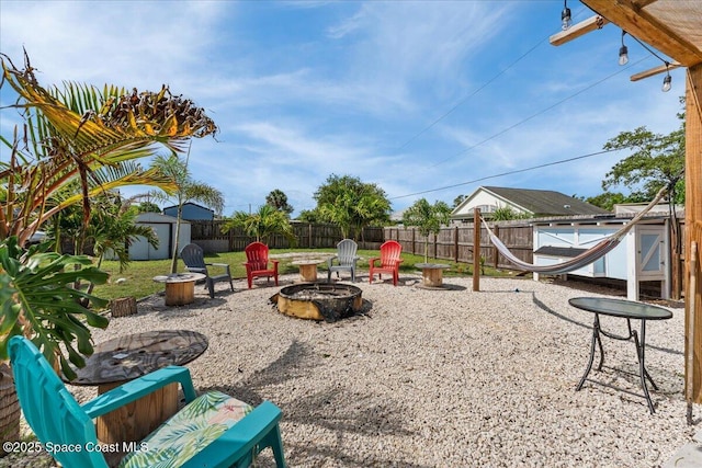 2350 Fallon Blvd NE, Palm Bay, FL 32907 - fenced backyard with an outdoor fire pit