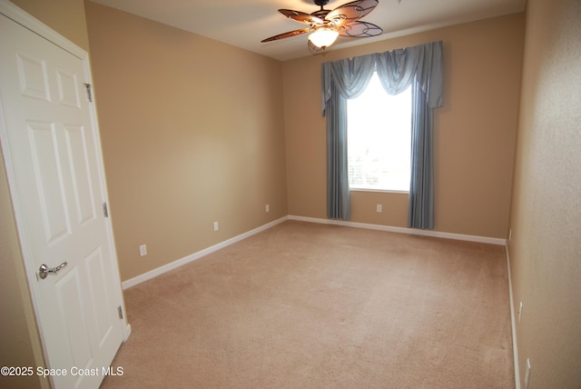 3868 Lexmark Ln Unit 205, Rockledge, FL 32955 - unfurnished room featuring light colored carpet, ceiling fan, and baseboards