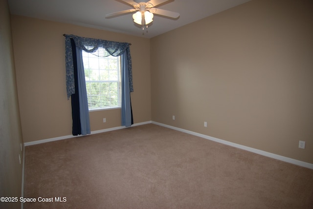 3868 Lexmark Ln Unit 205, Rockledge, FL 32955 - empty room with light colored carpet, ceiling fan, and baseboards