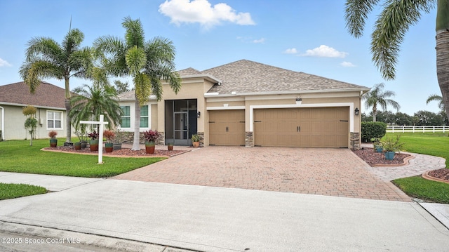 5852 Goleta Cir, Melbourne, FL 32940 - ranch-style house with decorative driveway, stucco siding, and a garage