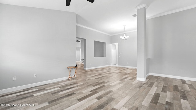 5852 Goleta Cir, Melbourne, FL 32940 - unfurnished room with a ceiling fan, a chandelier, baseboards, wood finished floors, and ornamental molding