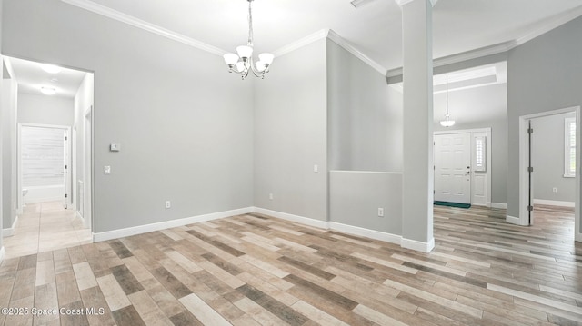 5852 Goleta Cir, Melbourne, FL 32940 - empty room featuring crown molding, baseboards, light wood finished floors, and a chandelier